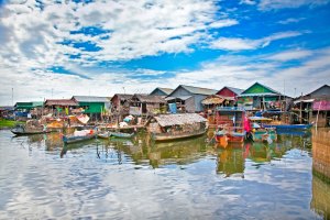Colorful shacks floating on a river in Cambodia
