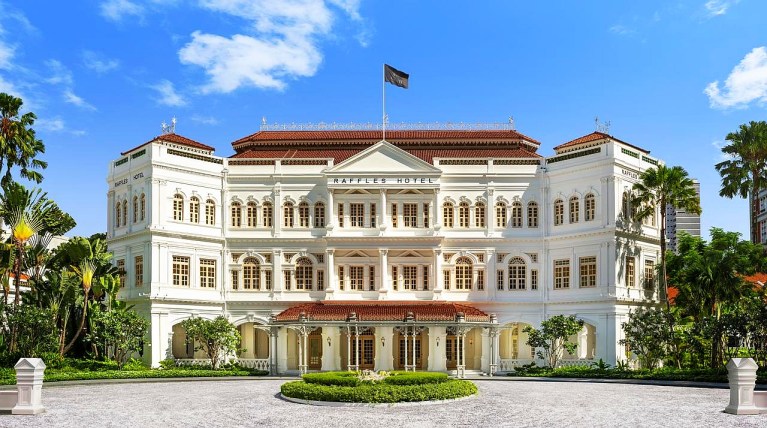 Large white hotel building Raffles Hotel Singapore