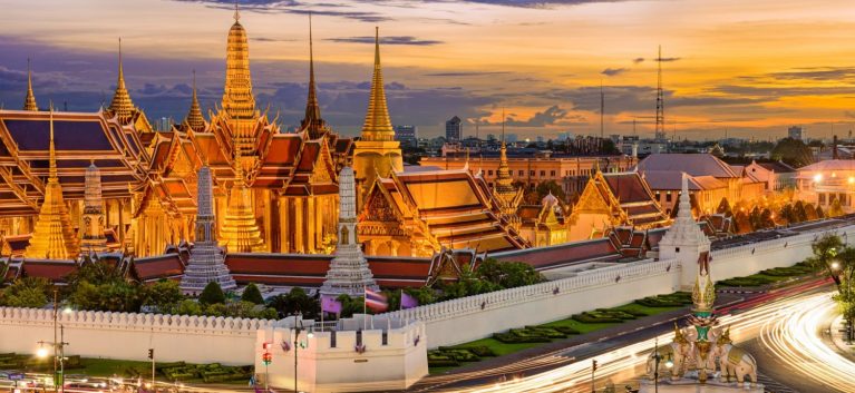 Traditional Thai towers at sunset Grand Palace Bankok Thailand