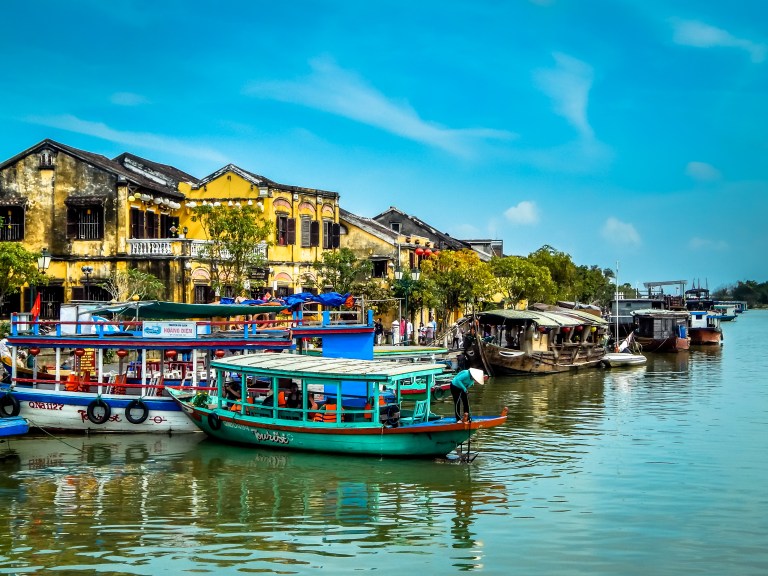Colorful river boats on river in Hoi An Vietnam