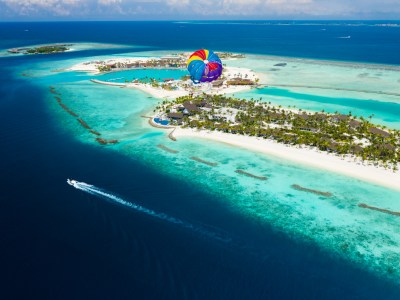 Colorful parachute above island