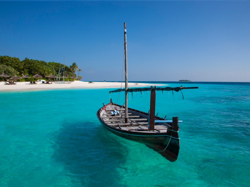 Traditional sail boat on turquoise sea water