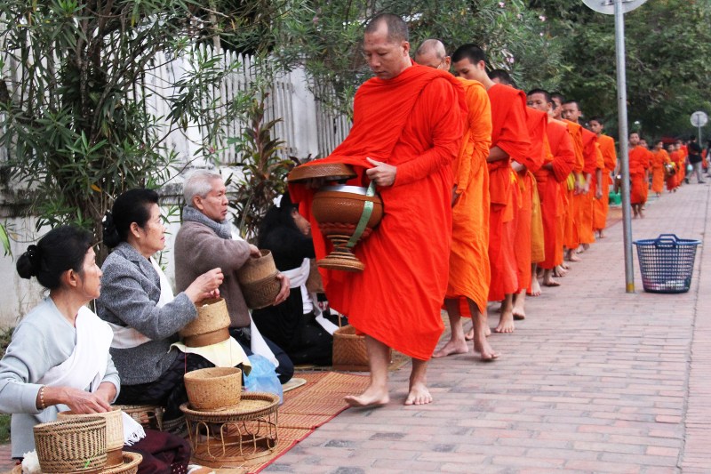 Monks in orange robes walking