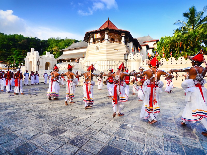 Group dancing in traditional red and white dress