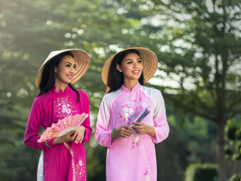 Two Vietnamese women smiling